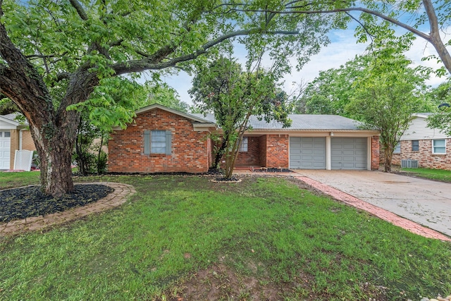 ranch-style home with a front lawn, central AC, brick siding, concrete driveway, and an attached garage