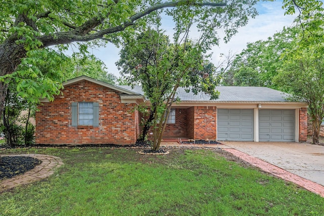single story home with an attached garage, a front lawn, driveway, and brick siding