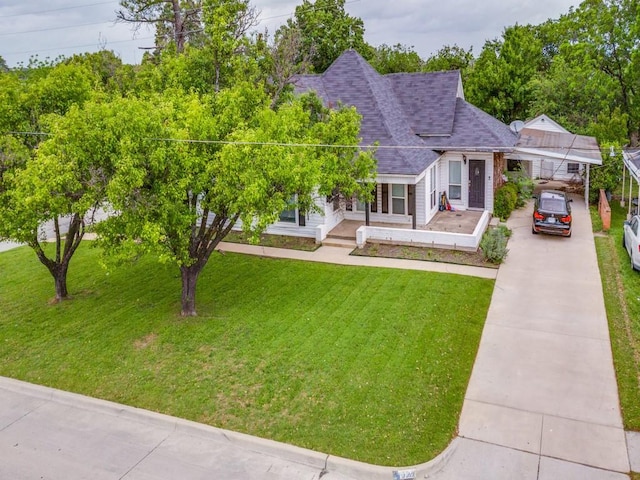 322 Hill St, Grand Prairie, TX 75050 - view of front of home featuring concrete driveway, a front yard, and roof with shingles