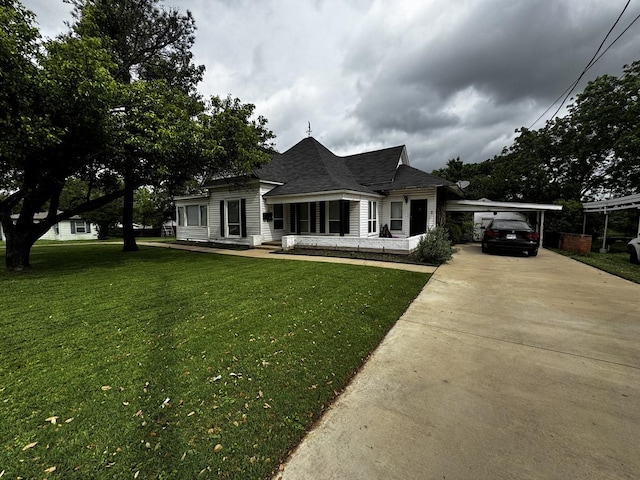 322 Hill St, Grand Prairie, TX 75050 - view of front facade featuring a porch, a shingled roof, a front lawn, and concrete driveway