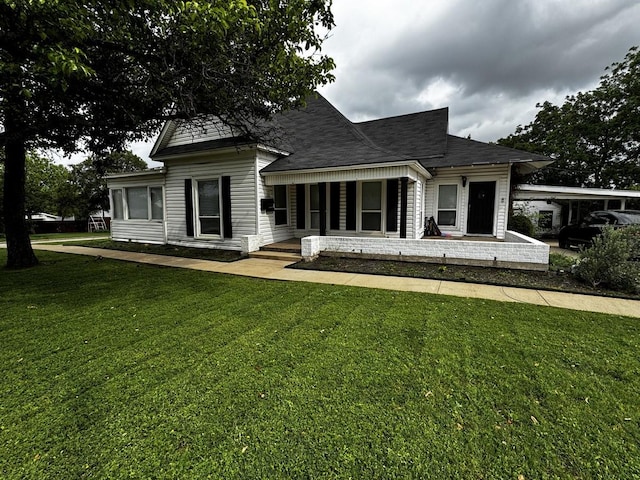 322 Hill St, Grand Prairie, TX 75050 - back of property featuring a lawn and covered porch