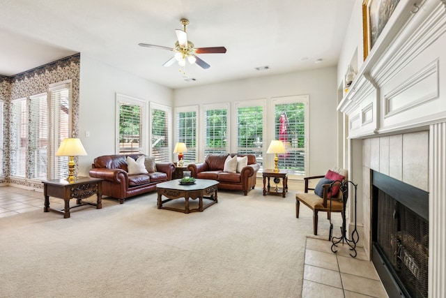3301 Gillespie Rd, Mckinney, TX 75072 - living room featuring ceiling fan, light colored carpet, a fireplace, and plenty of natural light