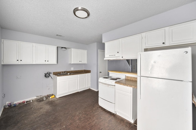 kitchen with a sink, white appliances, a textured ceiling, under cabinet range hood, and visible vents