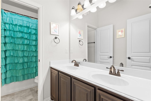 1005 Middleton St, Forney, TX 75126 - full bath featuring double vanity, toilet, and shower / bath combination with curtain