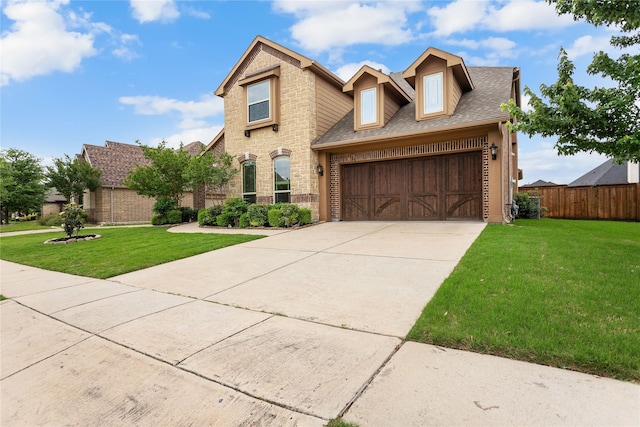 1005 Middleton St, Forney, TX 75126 - view of front of house featuring an attached garage, driveway, a shingled roof, and brick siding