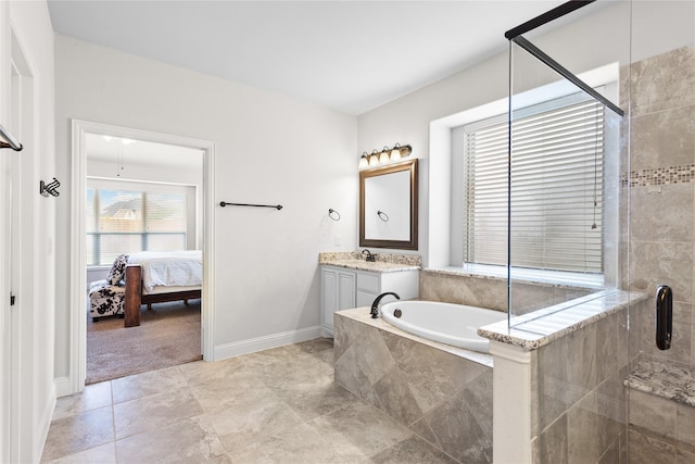 ensuite bathroom with vanity, ensuite bathroom, a bath, and a shower stall