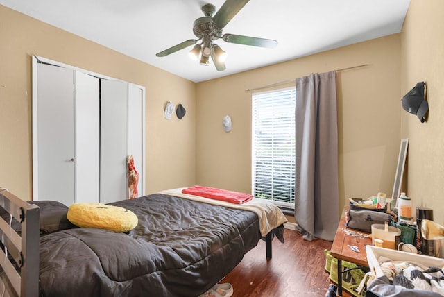 bedroom featuring a closet, ceiling fan, and wood finished floors