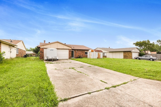 view of front of property featuring brick siding, a storage shed, a front yard, an outbuilding, and concrete driveway