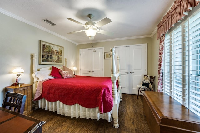 1621 Lake Hill Ln, Plano, TX 75023 - bedroom featuring wood finished floors, crown molding, multiple closets, and a ceiling fan