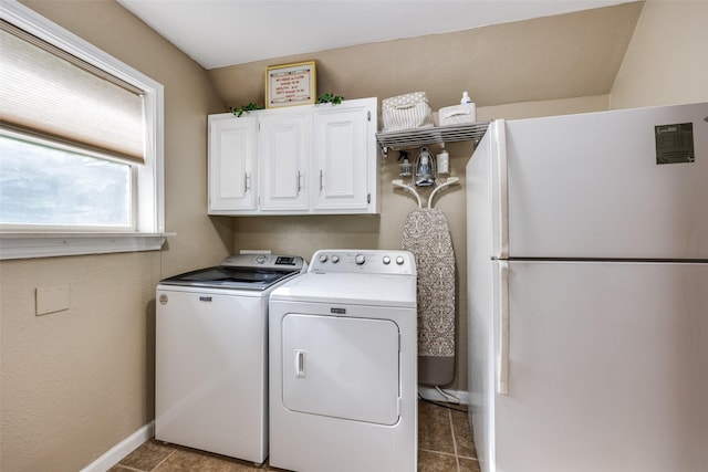 1621 Lake Hill Ln, Plano, TX 75023 - laundry room with washing machine and dryer, cabinet space, tile patterned flooring, and baseboards
