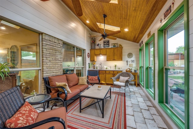 1621 Lake Hill Ln, Plano, TX 75023 - sunroom with ceiling fan, healthy amount of natural light, lofted ceiling, and a sink