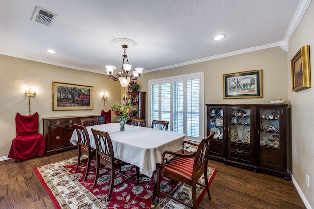 1621 Lake Hill Ln, Plano, TX 75023 - dining room with crown molding, a chandelier, dark wood-style flooring, baseboards, and recessed lighting