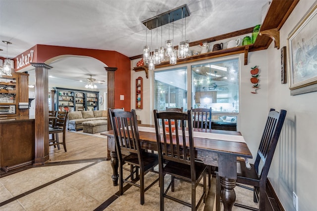 1621 Lake Hill Ln, Plano, TX 75023 - dining room with ceiling fan, inlaid floor details, decorative columns, arched walkways, and tile patterned flooring
