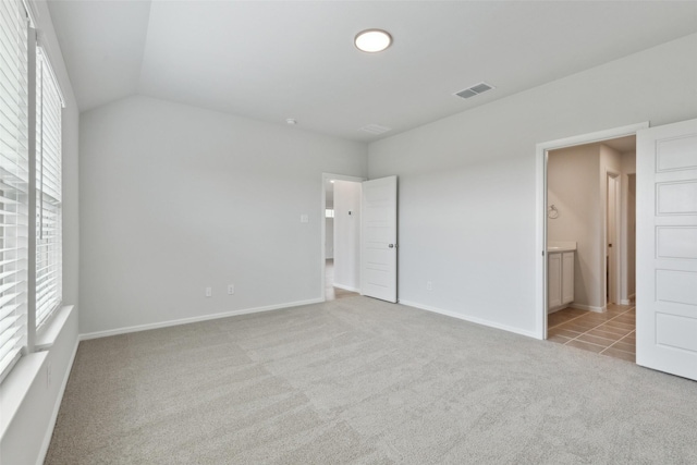 1946 Callington Way, Forney, TX 75126 - unfurnished bedroom featuring baseboards, light colored carpet, ensuite bath, and visible vents