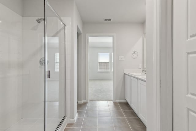 1946 Callington Way, Forney, TX 75126 - bathroom with visible vents, vanity, baseboards, tile patterned floors, and a stall shower