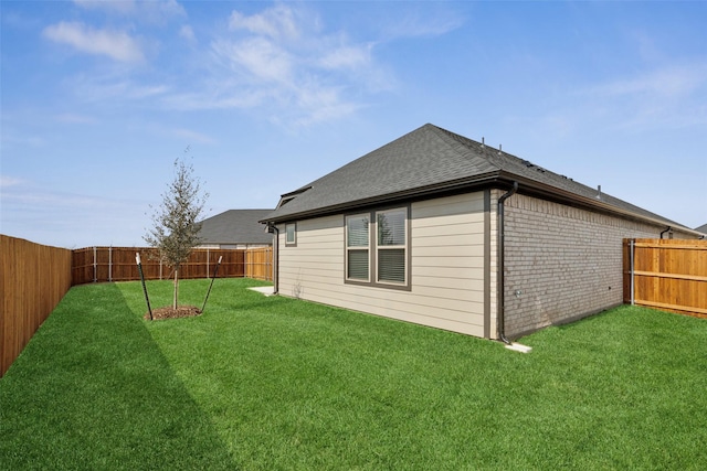 1946 Callington Way, Forney, TX 75126 - exterior space with a lawn, a shingled roof, a fenced backyard, and brick siding