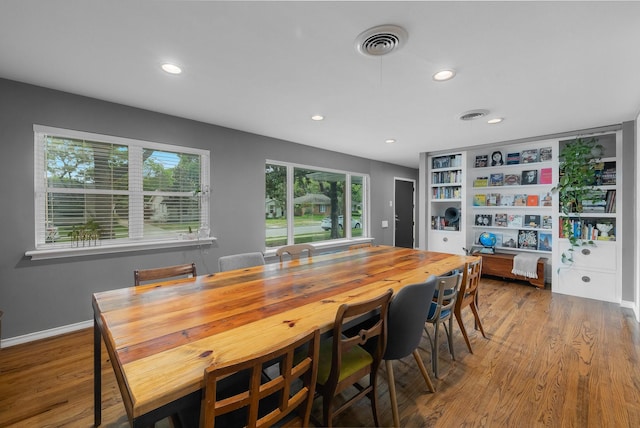 dining area featuring visible vents, recessed lighting, and wood finished floors