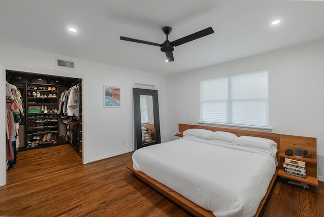 bedroom with visible vents, a closet, wood finished floors, recessed lighting, and a spacious closet