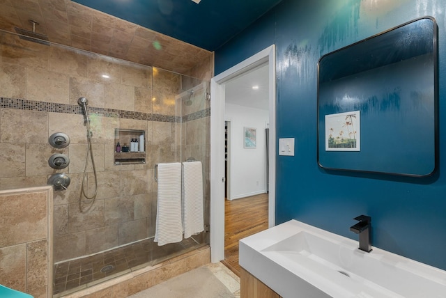 full bathroom with a shower stall and vanity