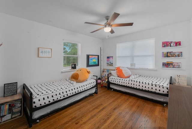 bedroom featuring ceiling fan and wood finished floors