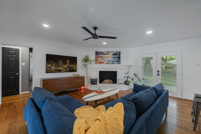 living area with recessed lighting, ceiling fan, wood finished floors, and french doors