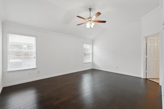 unfurnished room with vaulted ceiling, ornamental molding, a ceiling fan, and dark wood-type flooring