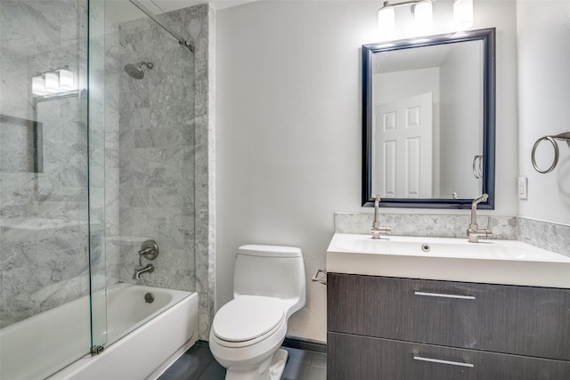 full bath with toilet, enclosed tub / shower combo, tile patterned flooring, and vanity