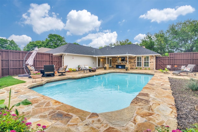 view of swimming pool with a fenced backyard, a fenced in pool, and a patio