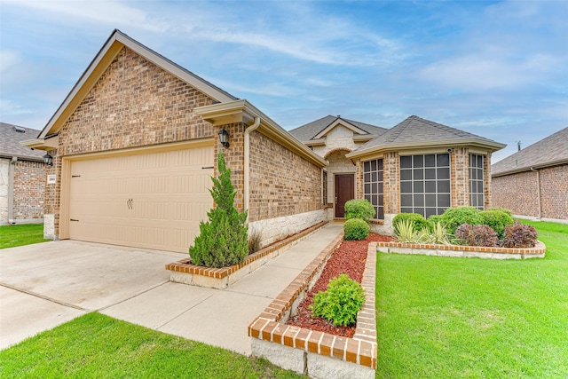 ranch-style house featuring a garage, a front lawn, roof with shingles, brick siding, and driveway