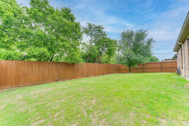 view of yard featuring a fenced backyard