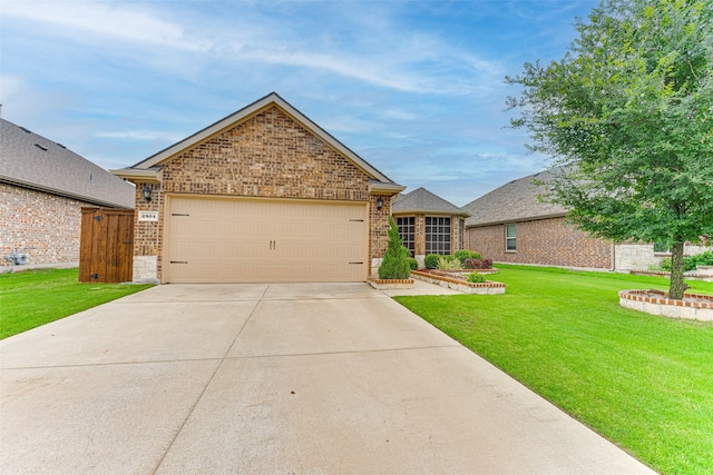 view of front of property with concrete driveway, brick siding, a front yard, and a garage