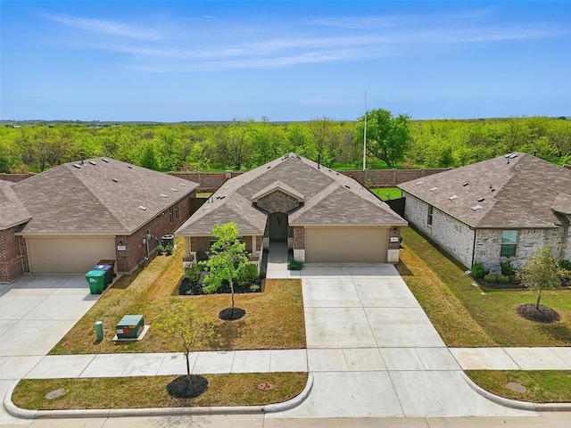 3613 Ridgeway Ln, Denton, TX 76226 - view of front of property with brick siding, driveway, a garage, and a front yard