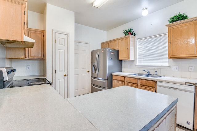 2839 Meadow Way Ln, Dallas, TX 75228 - kitchen with a sink, light countertops, under cabinet range hood, light brown cabinets, and stainless steel appliances