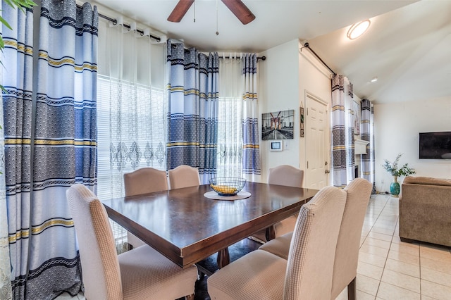 2839 Meadow Way Ln, Dallas, TX 75228 - dining area featuring vaulted ceiling, a ceiling fan, light tile patterned flooring, and a wealth of natural light
