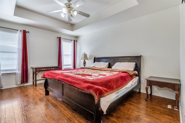 2839 Meadow Way Ln, Dallas, TX 75228 - bedroom with baseboards, a tray ceiling, ceiling fan, and wood finished floors