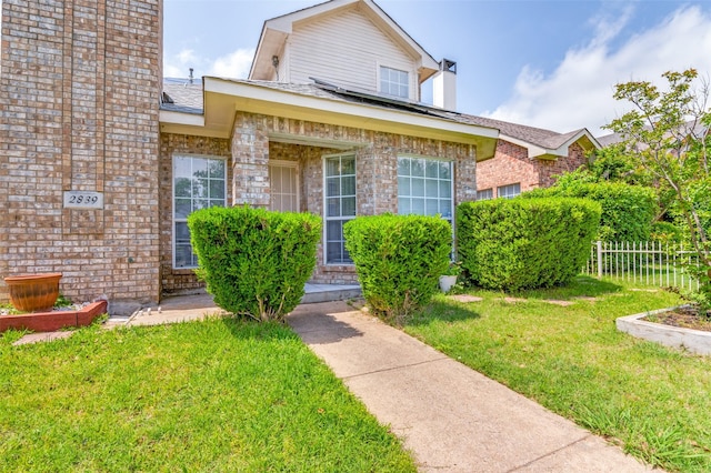 2839 Meadow Way Ln, Dallas, TX 75228 - view of front of property featuring brick siding, fence, and a front yard
