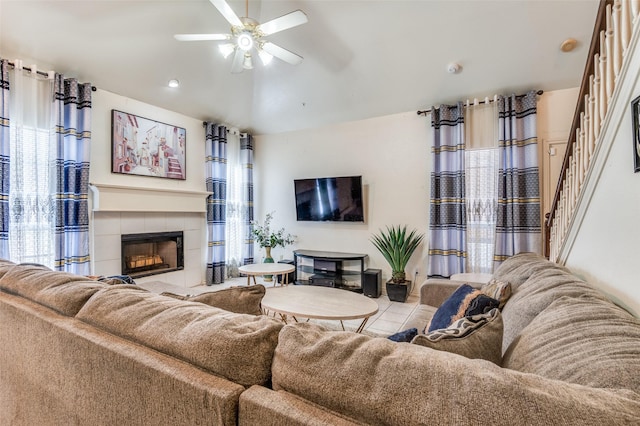 2839 Meadow Way Ln, Dallas, TX 75228 - tiled living area with stairs, a ceiling fan, a healthy amount of sunlight, and a tile fireplace