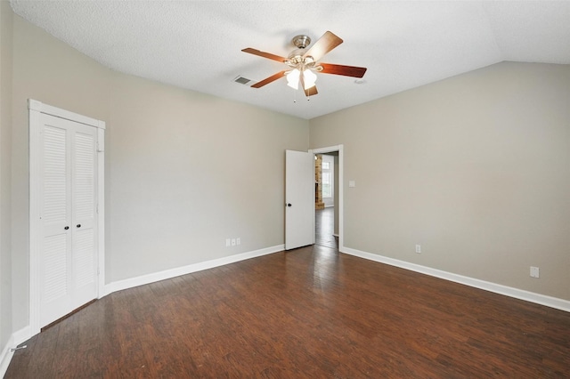6317 N Park Dr, Watauga, TX 76148 - spare room with baseboards, ceiling fan, dark wood-style flooring, and visible vents