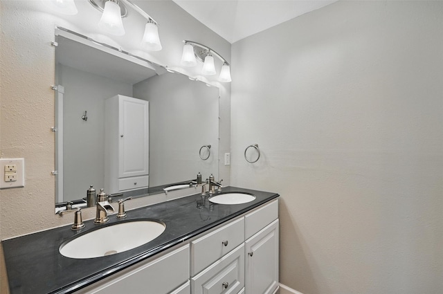 6317 N Park Dr, Watauga, TX 76148 - bathroom featuring double vanity and a sink