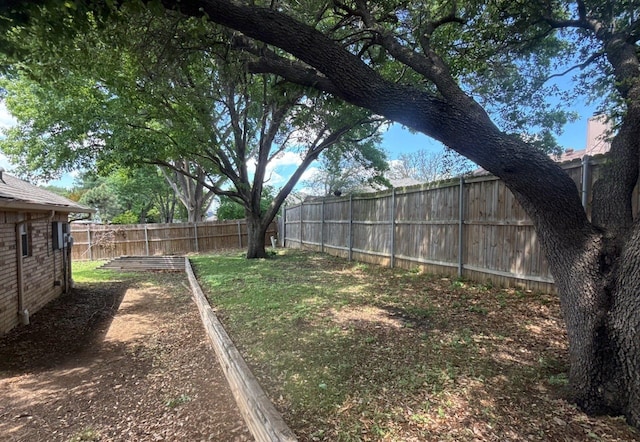 view of yard featuring a fenced backyard