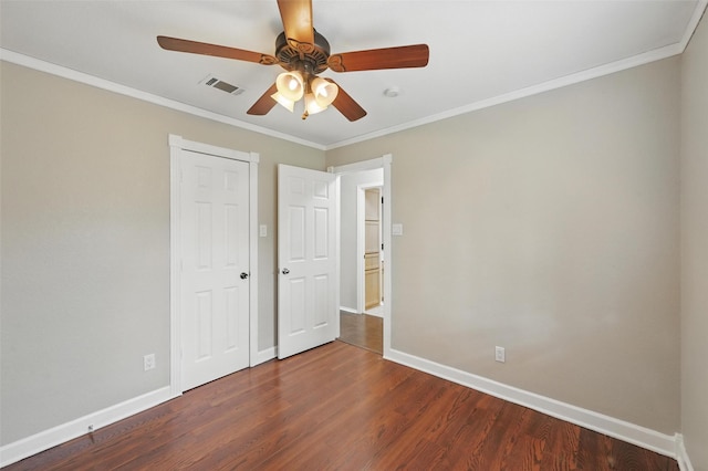 6317 N Park Dr, Watauga, TX 76148 - unfurnished bedroom featuring dark wood-style flooring, baseboards, and ornamental molding