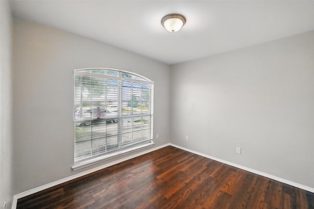 6317 N Park Dr, Watauga, TX 76148 - unfurnished room featuring baseboards and dark wood-style floors