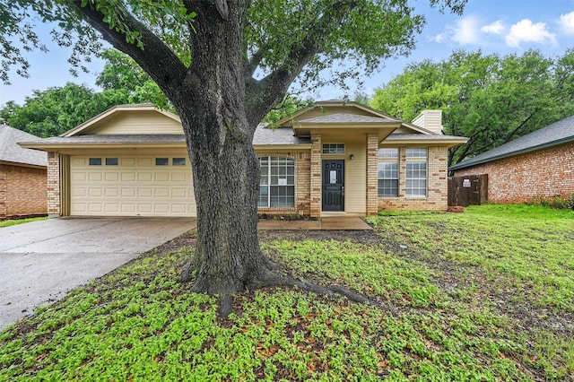 6317 N Park Dr, Watauga, TX 76148 - view of front of house featuring concrete driveway, brick siding, a chimney, and a garage