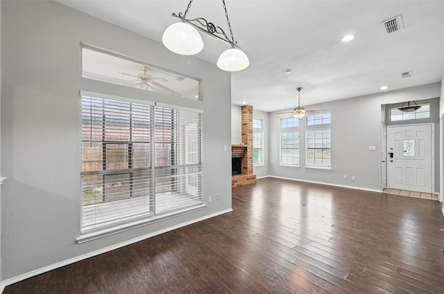 6317 N Park Dr, Watauga, TX 76148 - unfurnished dining area with baseboards, ceiling fan, visible vents, and wood finished floors