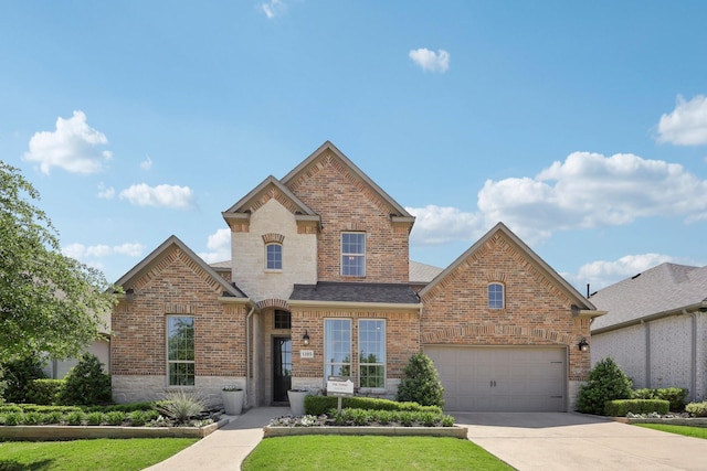 traditional home with a shingled roof, a front lawn, stone siding, brick siding, and driveway