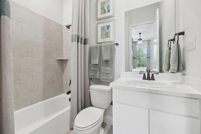 full bathroom featuring vanity, ceiling fan, shower / bath combo with shower curtain, and toilet