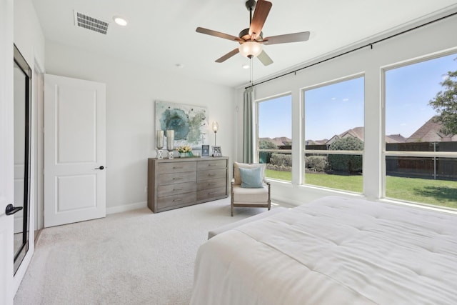 carpeted bedroom featuring a ceiling fan, baseboards, visible vents, and recessed lighting