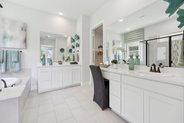 full bath with a garden tub, a stall shower, a sink, tile patterned floors, and recessed lighting