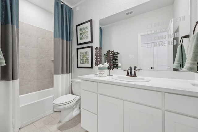 bathroom featuring tile patterned flooring, shower / tub combo with curtain, vanity, toilet, and visible vents
