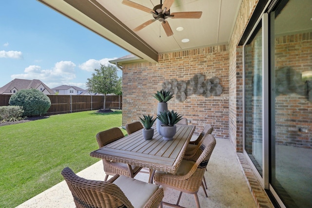 view of patio / terrace featuring a fenced backyard, outdoor dining space, and ceiling fan